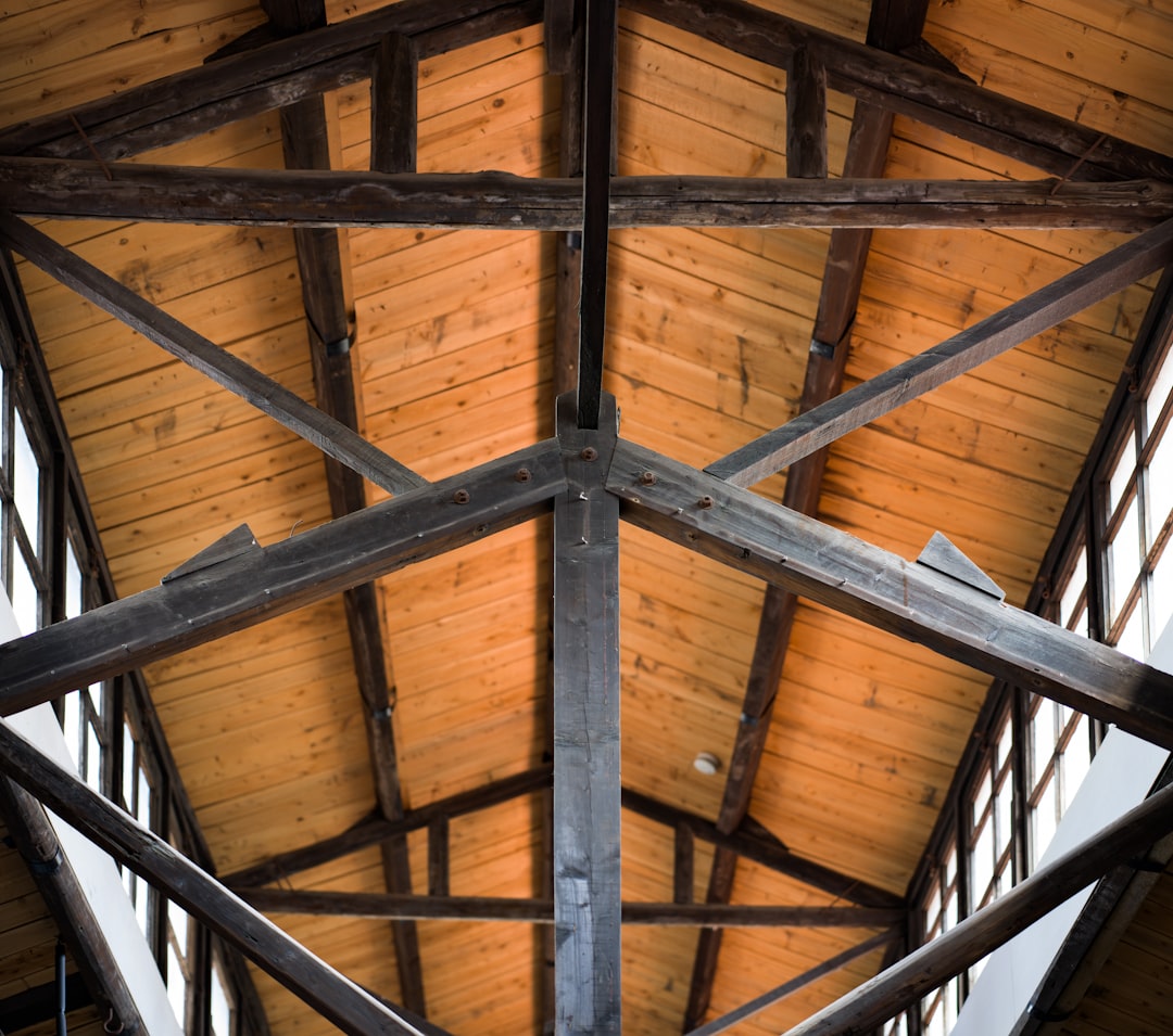 A view of a wooden ceiling with beams